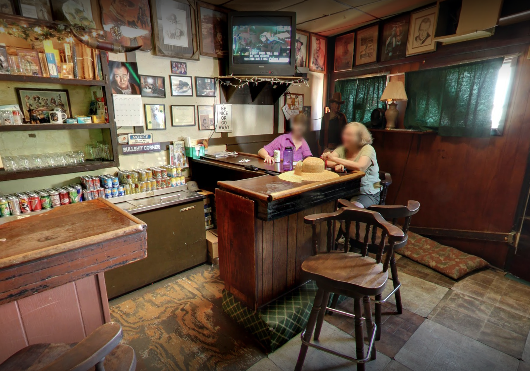 Two people sitting at the bar.