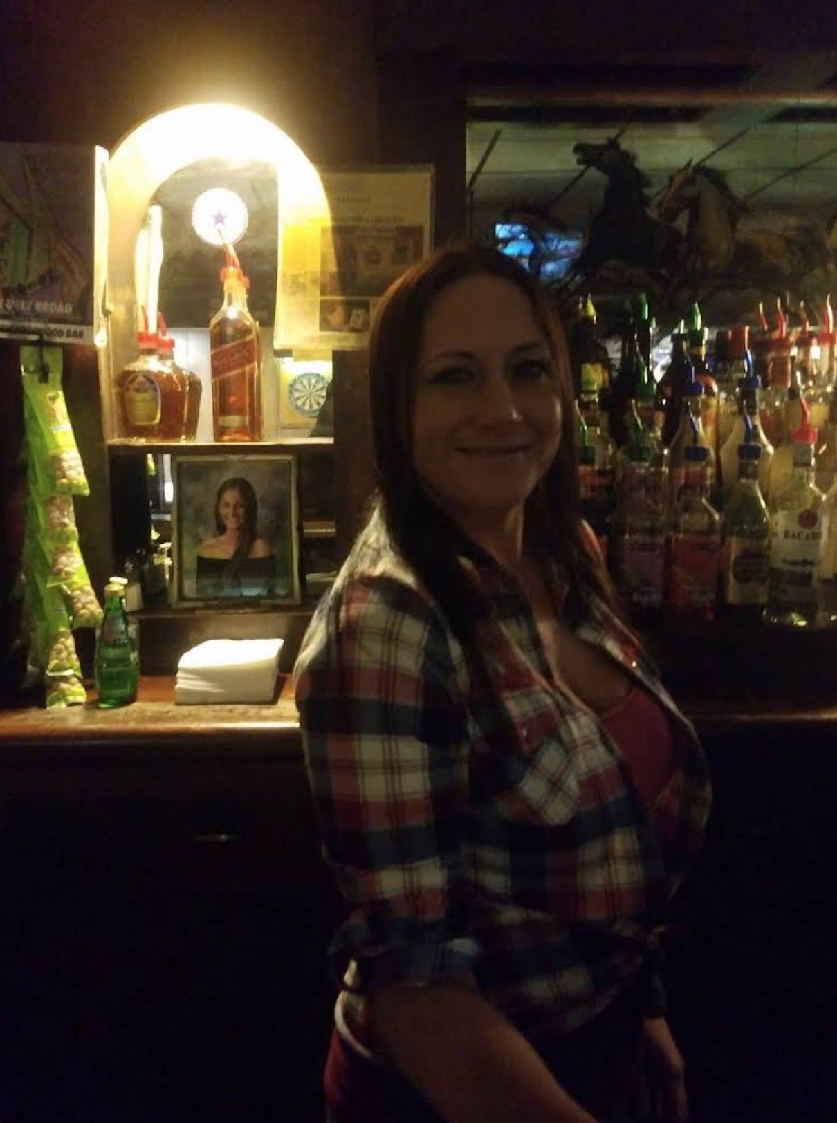 Bartender behind the bar.