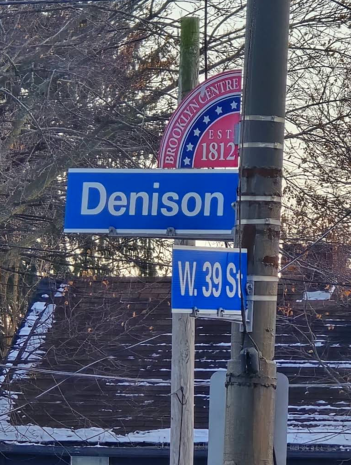 Street signs for the Denison and W 39th St intersection.