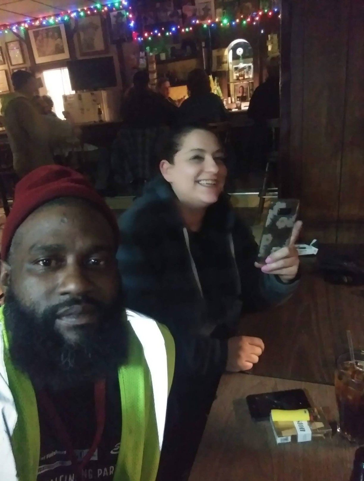 People at a table inside The Ugly Broad.