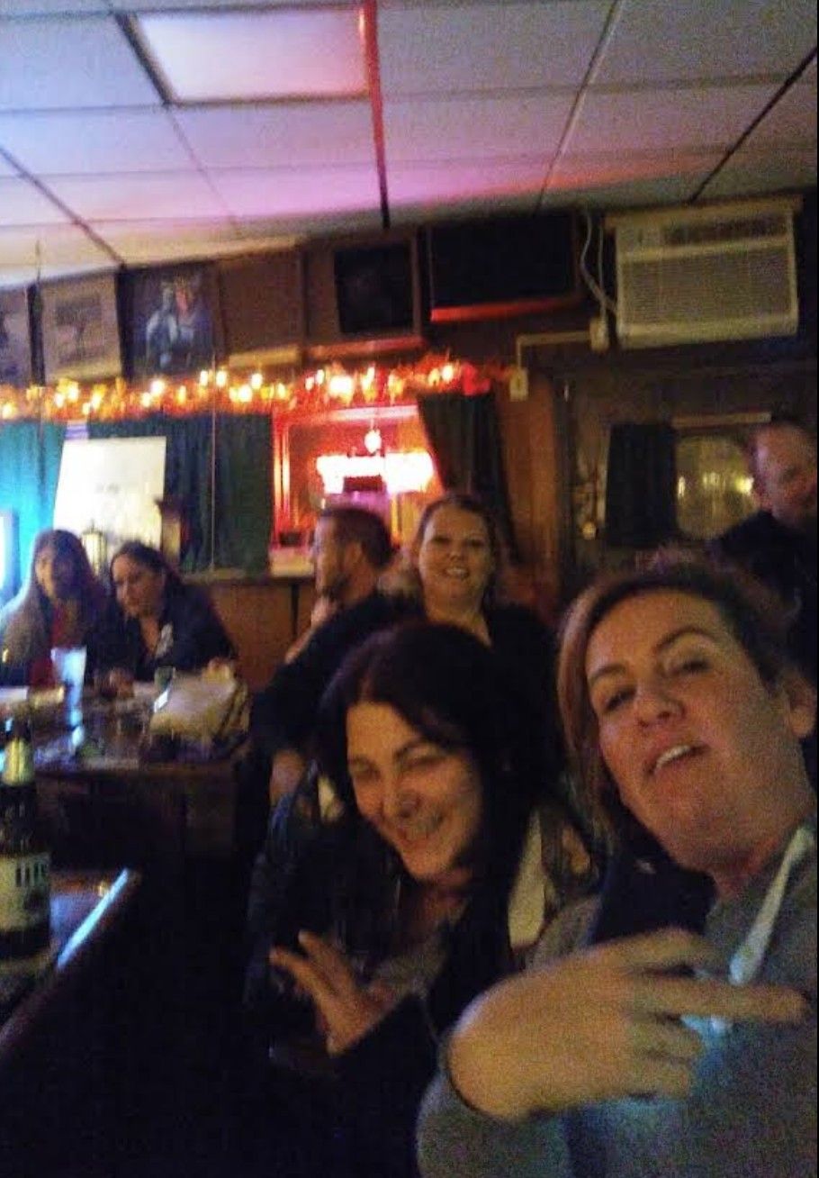 People at the bar on a busy night.