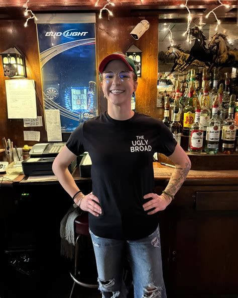 Bartender standing behind the bar.
