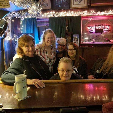Group picture at the bar.