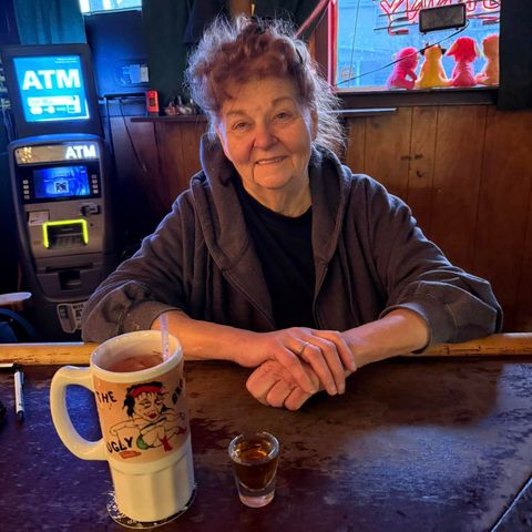 Sherry Perry, original owner of The Ugly Broad, sitting at the bar.