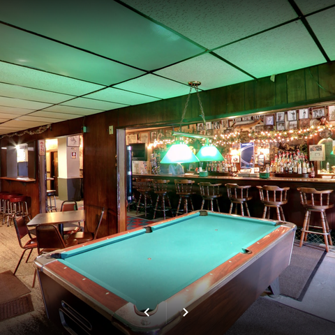 The Ugly Broad pool table with bar in background.