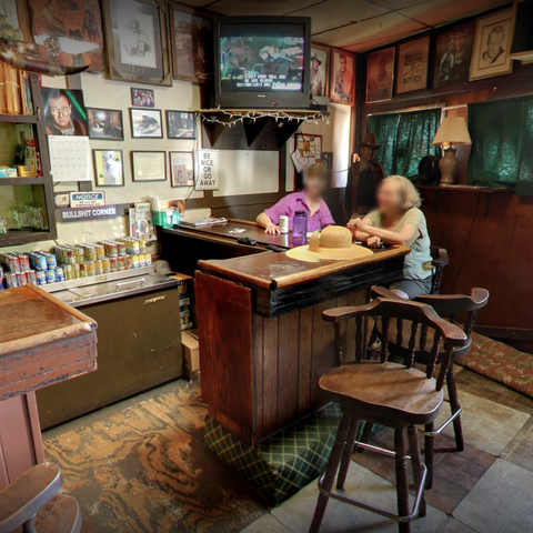 Two people sitting at the bar.