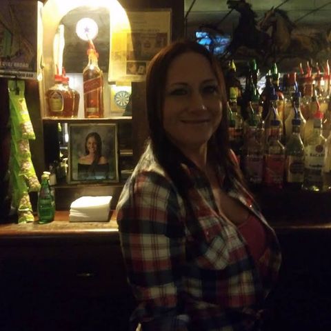 Bartender behind the bar.