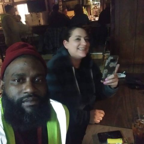 People at a table inside The Ugly Broad.