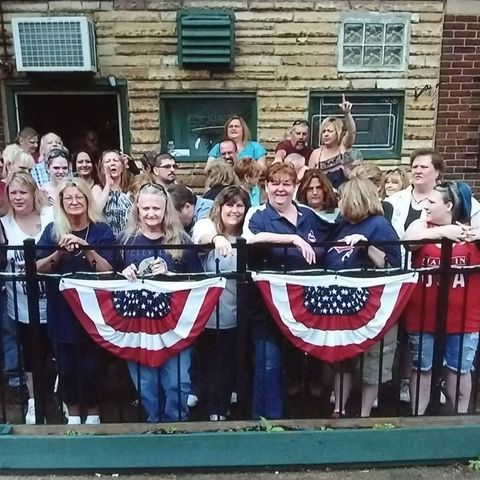 Group photo on outside patio at The Ugly Broad.