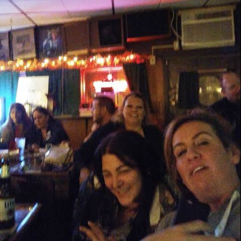 People at the bar on a busy night.